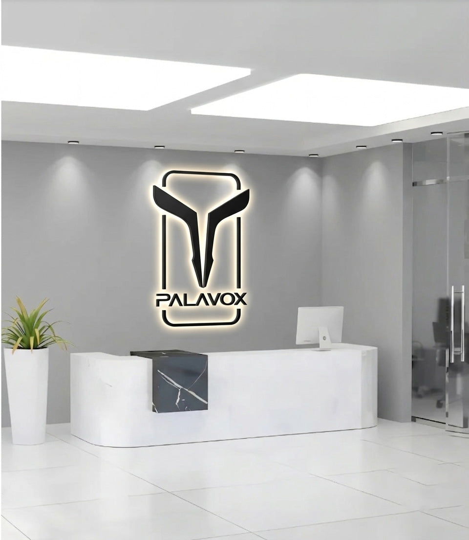 Modern PALAVOX office reception desk with backlit illuminated company logo wall.